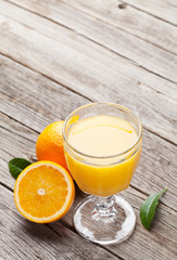 Fresh ripe oranges and juice