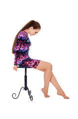 Fototapeta premium woman with very long beautiful hair sitting on a chair
