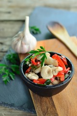 Appetizer of pickled oyster mushrooms, pepper, onion,  herbs, garlic