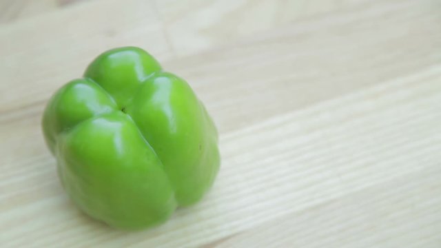 Green bell pepper healthy vegetables food on wooden table