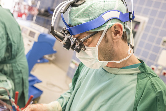 Surgeons executing heart bypass surgery