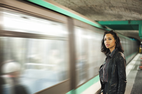 France, Paris, young woman at underground station