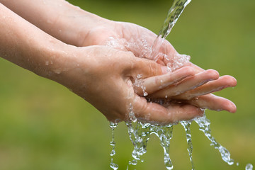closeup of woman washing her hands
