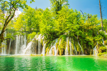 Naklejka premium Beautiful landscape, waterfall and clear green water in the Plitvice Lakes National Park in Croatia. Beautiful world. 