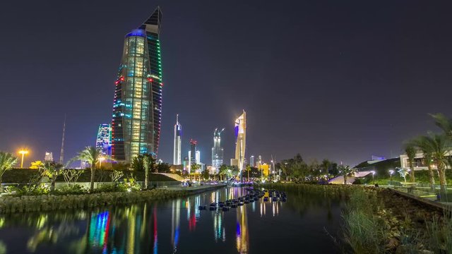 Music fountains in park with Kuwait City cityscape night timelapse hyperlapse