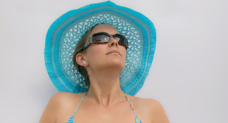 Woman with a blue hat