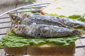 Sandwich Kamut, tapas with sardines, sprats with olives and herb