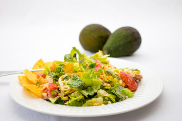 mexican salad on a white plate close up 