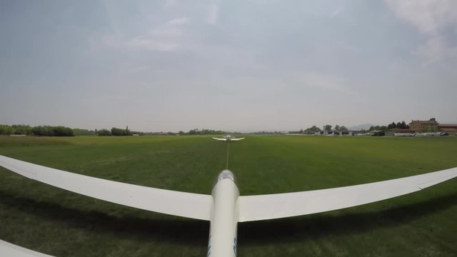 Glider Take off from a grass airfield. 4K Ultra HD Video.