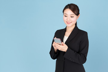 portrait of asian businesswoman isolated on blue background