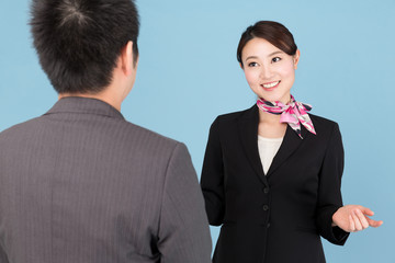 portrait of asian businesswoman isolated on blue background
