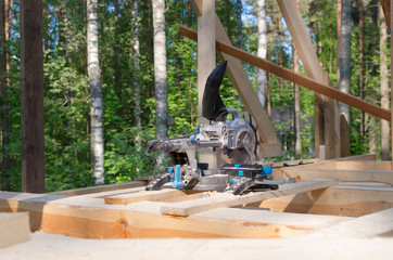 miter saw in building area. tools in wooden house. building ecol