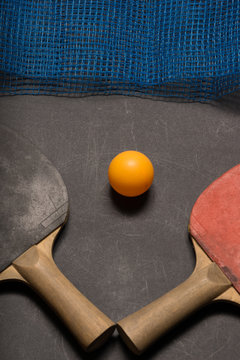 Old pingpong paddles and ball.