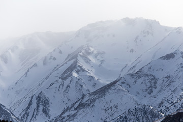 Fototapeta na wymiar snow-capped mountains of the Tien Shan in the winter. Kazakhstan
