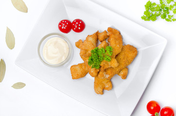 Nuggets with sauce on a plate
