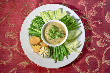 Hors d'oeuvres food Northern style tradition Thai cuisine menu with herbs fried boiled cabbage, boiled pumpkin, sour pork, chili youth delicious food in Chiang mai province Thailand.