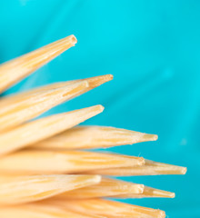 toothpicks on a blue background. macro