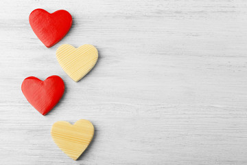 Obraz premium Wooden hearts on light background