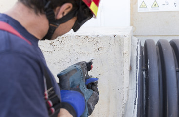 Firefighter doing work with a cordless drill