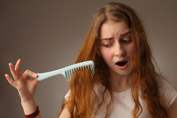 young nervous woman brush her hair