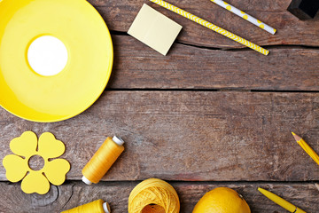 Yellow colour flat lay composition on wooden background