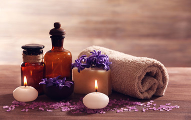 Spa composition with spring flowers on wooden table