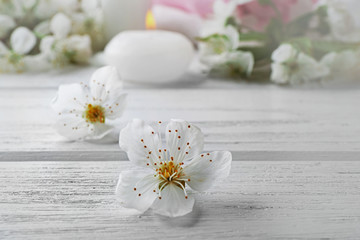 Fototapeta na wymiar White flower on wooden table