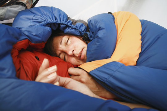 Woman sleeping in sleeping bag