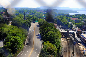 Through the chain linked fence on the overpass.  Poughkeepsie NY