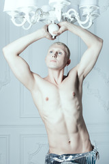 Male albino in a white room.