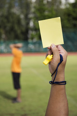 soccer Referee show yellow card