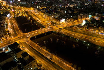 Skyline of Ho Chi Minh city by night with trails of lights, Viet