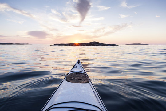Kayak in sea during sunset