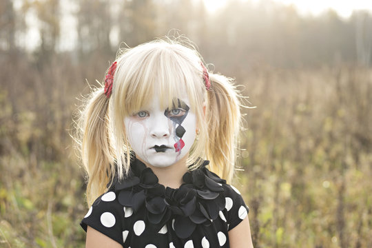 Portrait of girl with painted face