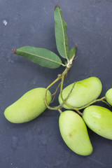 green fresh mango on black