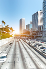 busy traffic on road in downtown of los angeles in fine day