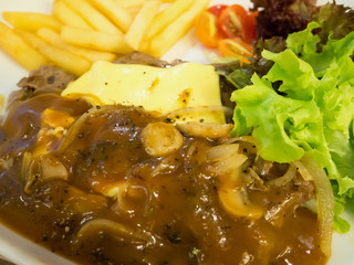 Grilled beef steak with cheese