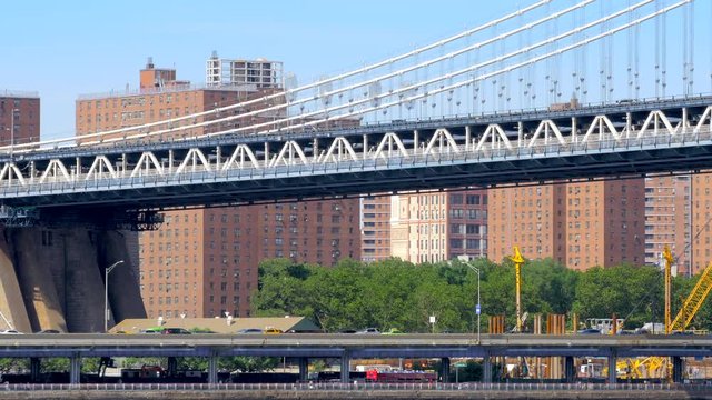 Urban NYC scenery street traffic Manhattan bridge FDR Drive expressway New York City sunny day