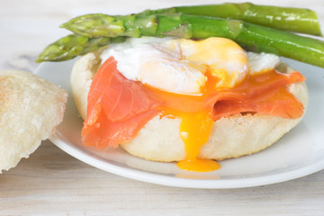 Close up of English muffin with poached egg