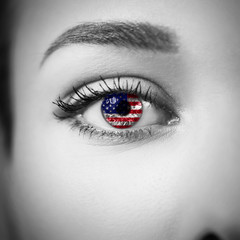 Close-up female eye with country flag
