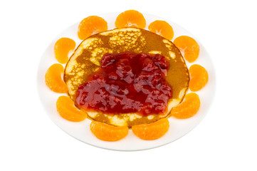 Obraz na płótnie Canvas pancake and orange and strawberry sauce on white plate