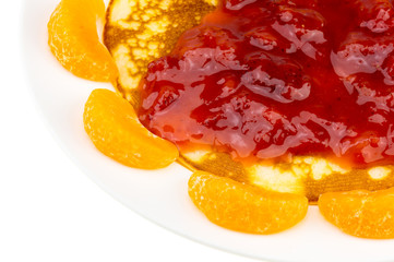 Fototapeta na wymiar pancake and orange and strawberry sauce on white plate