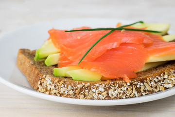Closeup of sandwich with avocado and smoked salmon