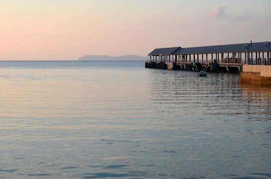 Tioman, Malaysia - April 18, 2016: The canopy covered jetty at Kampung Tekek at sunset. The jetty receives light commercial and passenger vessels from mainland ports of Mersing and Tanjong Gemok. 
