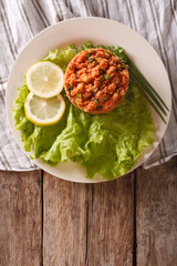 Turkish appetizer spicy Kisir close-up on the table. Vertical top view

