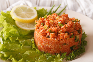 Turkish salad of bulgur Kisir close-up. horizontal
