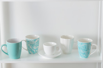 Clean dishes on wooden shelf