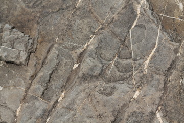 Cracked stone wall background