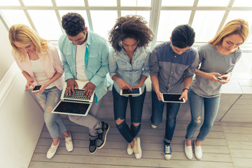 Fototapeta premium Young people with gadgets