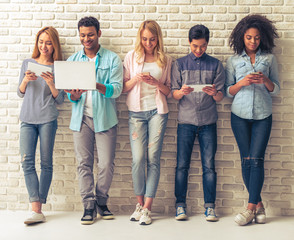 Fototapeta premium Young people with gadgets